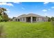Home with an expansive backyard and covered patio at 15500 Fountain Cove Ct, Winter Garden, FL 34787