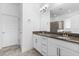 Bathroom boasts double sinks, granite countertops, and a large mirror, and walk-in shower at 15500 Fountain Cove Ct, Winter Garden, FL 34787