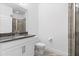 Bathroom featuring granite countertop, a sink and a toilet, next to walk-in shower at 15500 Fountain Cove Ct, Winter Garden, FL 34787