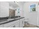 Bathroom with granite countertops, dual sinks and shower at 15500 Fountain Cove Ct, Winter Garden, FL 34787