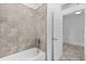 A bathroom with tile surround and a bathtub at 15500 Fountain Cove Ct, Winter Garden, FL 34787