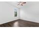A bright bedroom featuring wood flooring, a ceiling fan, and a window with blinds at 15500 Fountain Cove Ct, Winter Garden, FL 34787