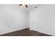 A bright bedroom featuring wood flooring and a white door at 15500 Fountain Cove Ct, Winter Garden, FL 34787