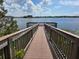 Scenic view from the wooden walkway and platform on the lake, showcasing natural beauty at 15500 Fountain Cove Ct, Winter Garden, FL 34787