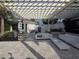 Relaxing outdoor lounge area features comfortable seating and shade, perfect for socializing at 15500 Fountain Cove Ct, Winter Garden, FL 34787