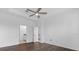 Large bedroom with wood floors, a ceiling fan, and an ensuite bathroom at 15500 Fountain Cove Ct, Winter Garden, FL 34787