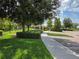 Well-maintained parking area with lush greenery and mature trees creates a welcoming and serene environment at 15500 Fountain Cove Ct, Winter Garden, FL 34787