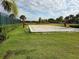 Sandy volleyball court surrounded by green grass, creating a fun community space at 15500 Fountain Cove Ct, Winter Garden, FL 34787