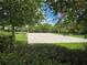 Outdoor sand volleyball court surrounded by lush greenery provides a perfect space for recreation and leisure at 15500 Fountain Cove Ct, Winter Garden, FL 34787