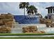 Waterleigh entrance fountain featuring a blue tile cascade and rock accents for a welcoming community landmark at 15500 Fountain Cove Ct, Winter Garden, FL 34787