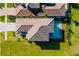 Aerial view of house showing tile roof, pool, backyard and pristine landscaping at 15942 Vetta Dr, Bella Collina, FL 34756