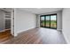 Bedroom with large windows and luxury vinyl plank flooring at 15942 Vetta Dr, Bella Collina, FL 34756