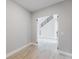 Bright entryway with glass doors and a view of the staircase at 15942 Vetta Dr, Bella Collina, FL 34756