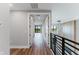 Hallway showcasing luxury vinyl plank flooring and bright natural light at 15942 Vetta Dr, Bella Collina, FL 34756