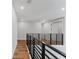 A hallway with luxury vinyl plank flooring and an open ceiling at 15942 Vetta Dr, Bella Collina, FL 34756