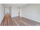 A hallway with luxury vinyl plank flooring and gray walls at 15942 Vetta Dr, Bella Collina, FL 34756