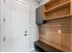 Well-organized mudroom with custom built-ins, providing convenient storage and a stylish entry point at 15942 Vetta Dr, Bella Collina, FL 34756