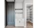 Walk in pantry with custom shelves, cabinet and wine rack near the kitchen at 15942 Vetta Dr, Bella Collina, FL 34756