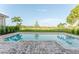 Backyard features a private swimming pool and expansive views at 15942 Vetta Dr, Bella Collina, FL 34756