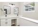Bathroom featuring double sinks with modern fixtures and natural light at 1660 Justin Matthew Way, St Cloud, FL 34771