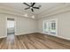 Spacious main bedroom with tray ceilings, ceiling fan and access to the lanai at 1660 Justin Matthew Way, St Cloud, FL 34771