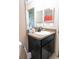Bathroom featuring a dark vanity with a light countertop, sink, large mirror, and neutral walls at 16863 Sw 29Th Terrace Rd, Ocala, FL 34473