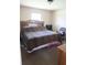 Bedroom with leopard print bedding and an ornate wooden headboard at 16863 Sw 29Th Terrace Rd, Ocala, FL 34473