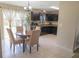 Inviting dining area with dark cabinetry and view to the backyard at 16863 Sw 29Th Terrace Rd, Ocala, FL 34473
