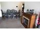 Comfortable dining room area featuring a decorative fireplace, table, and chairs at 16863 Sw 29Th Terrace Rd, Ocala, FL 34473
