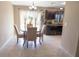 Cozy dining area with sliding door access and decorative features at 16863 Sw 29Th Terrace Rd, Ocala, FL 34473