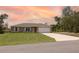 Well-maintained single-story home features a lush lawn, neutral paint, and a two-car attached garage at 16863 Sw 29Th Terrace Rd, Ocala, FL 34473