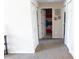 Hallway featuring neutral carpet, white walls, and access to multiple rooms and closets in the home at 16863 Sw 29Th Terrace Rd, Ocala, FL 34473
