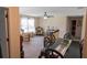 Open living area with ceiling fan, plush carpet, and vintage furniture arrangement at 16863 Sw 29Th Terrace Rd, Ocala, FL 34473