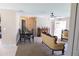 Open-concept living space featuring ceiling fan, plush carpet, and vintage-style furniture at 16863 Sw 29Th Terrace Rd, Ocala, FL 34473