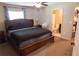 Comfortable main bedroom with a ceiling fan and ensuite bathroom at 16863 Sw 29Th Terrace Rd, Ocala, FL 34473