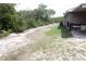 Side yard with grass and equipment at 16863 Sw 29Th Terrace Rd, Ocala, FL 34473
