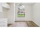 Bright bonus room boasts wood floors, large window and built-in cabinetry at 1802 Waterbeach Ct, Apopka, FL 32703