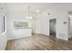 Open-concept dining area with vaulted ceiling, wood floors and lots of natural light at 1802 Waterbeach Ct, Apopka, FL 32703