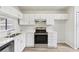 Well-lit kitchen with stainless steel appliances, white cabinetry, and easy-to-clean countertops at 1802 Waterbeach Ct, Apopka, FL 32703