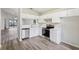 Modern kitchen featuring stainless steel appliances, white cabinets, and stylish countertops at 1802 Waterbeach Ct, Apopka, FL 32703