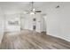 Light-filled living room featuring durable wood-look floors and an open layout design at 1802 Waterbeach Ct, Apopka, FL 32703