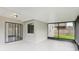 Enclosed patio area featuring neutral paint colors and screens at 1802 Waterbeach Ct, Apopka, FL 32703