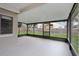 View of the large screened porch offering outdoor living space at 1802 Waterbeach Ct, Apopka, FL 32703
