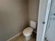 Small bathroom with a toilet and beige walls at 1922 Conway Rd # 1922, Orlando, FL 32812