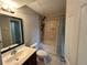 Cozy bathroom features tiled walls, a shower-tub combo, and a single sink vanity at 1922 Conway Rd # 1922, Orlando, FL 32812