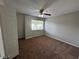 Bedroom with carpet, neutral paint, ceiling fan, and a bright window view at 1922 Conway Rd # 1922, Orlando, FL 32812