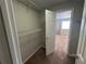 Spacious walk-in closet with wire shelves and access to the bedroom at 1922 Conway Rd # 1922, Orlando, FL 32812