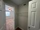 Walk-in closet with shelving and carpet, providing ample storage space at 1922 Conway Rd # 1922, Orlando, FL 32812
