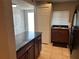 Kitchen island with granite countertops, wooden cabinets, and stainless steel sink at 1922 Conway Rd # 1922, Orlando, FL 32812