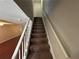 Carpeted staircase leading to the upper level of the house at 1922 Conway Rd # 1922, Orlando, FL 32812
